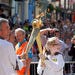 Handing over Olympic torch flame