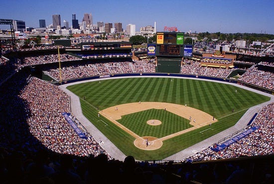 The Atlanta Braves at Turner Field with a view of the downtown Atlanta skyline (1998).