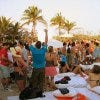 Patrons enjoy a festive atmosphere at  Nikki Beach, Miami.