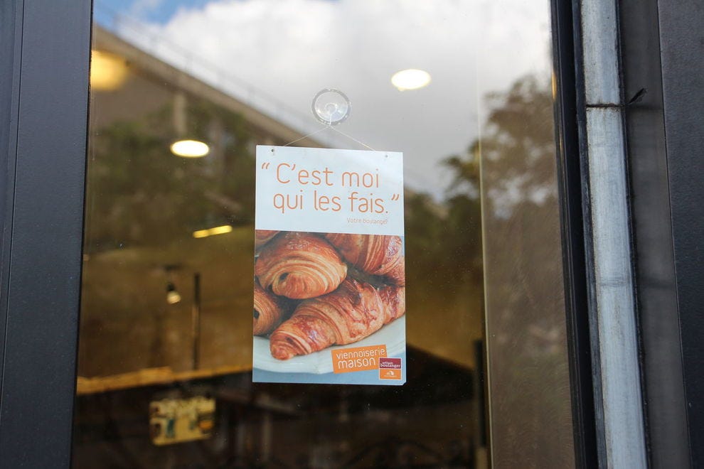 Sign showing a baker makes his croissants in-house