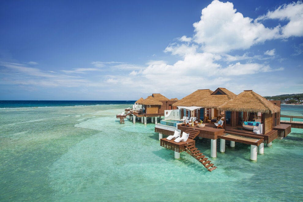 In Jamaica, over-the-water private island villas at Sandals Royal Caribbean come with floating water hammocks, see-through glass floors and infinity pools