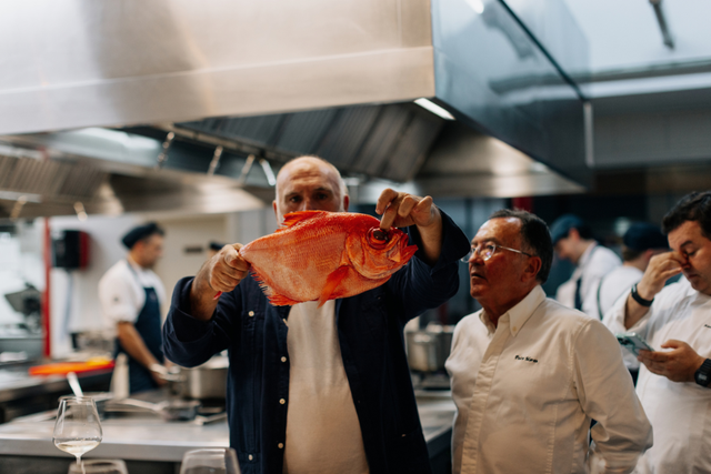 Chef José Andrés inspecting a fish